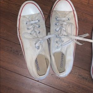 Worn white low top converse